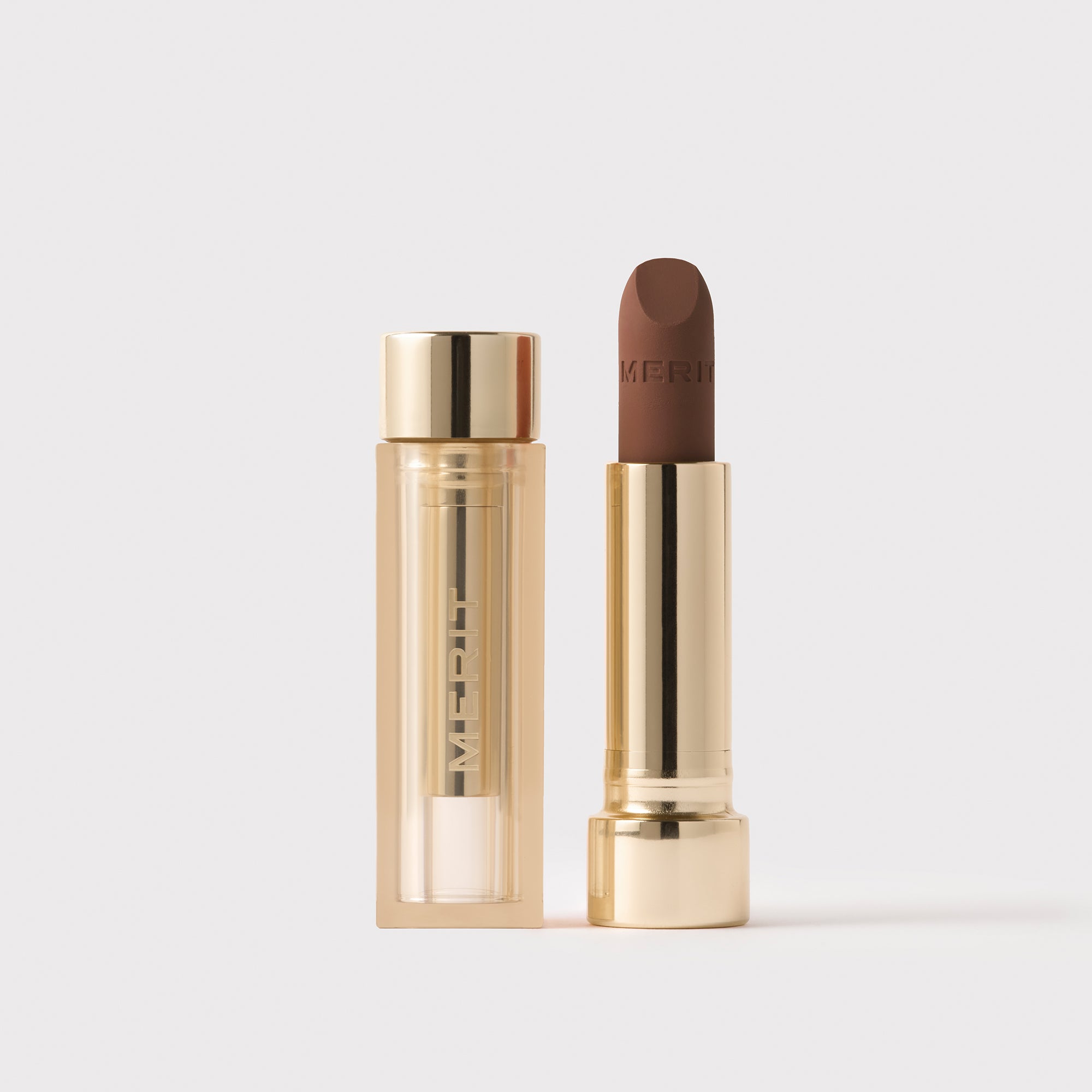 Master || Signature Lip Blush in Bespoke next to its case.