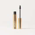 Brown Black | | Brow pomade with gold packaging on a white background
