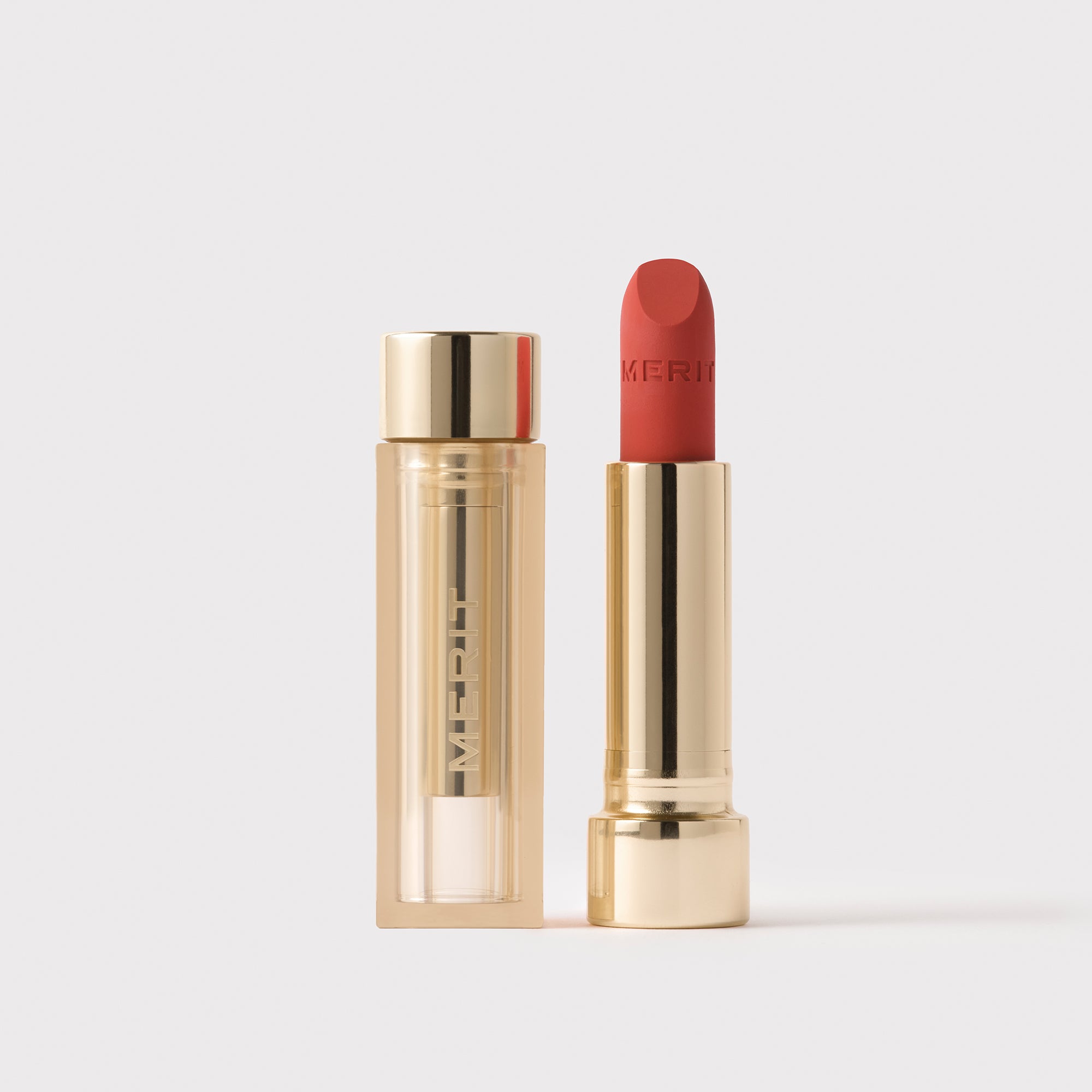 Master || Signature Lip Blush in Kitten Heel next to its case.