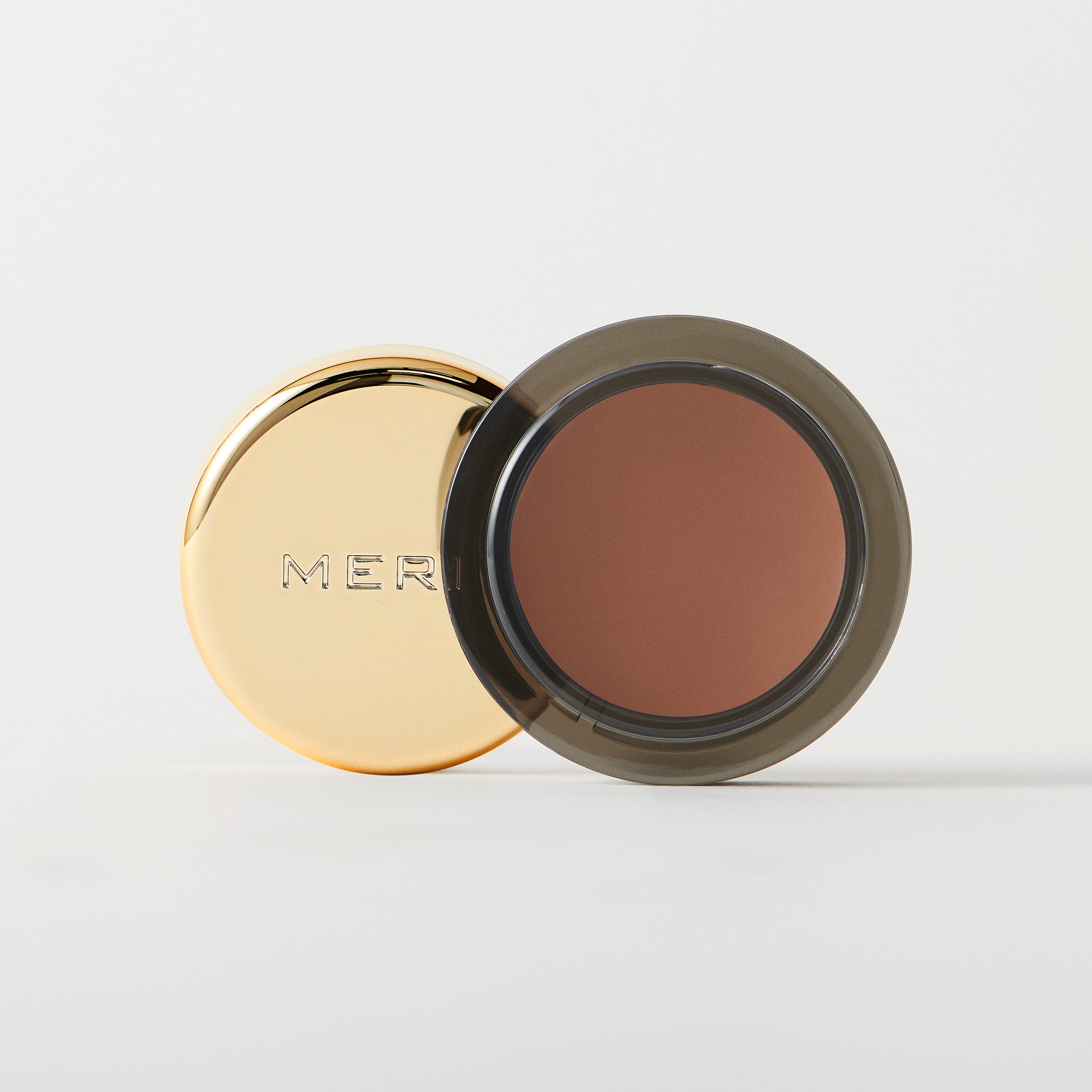 Master || A cream-to-powder eyeshadow by MERIT Beauty in Midcentury.