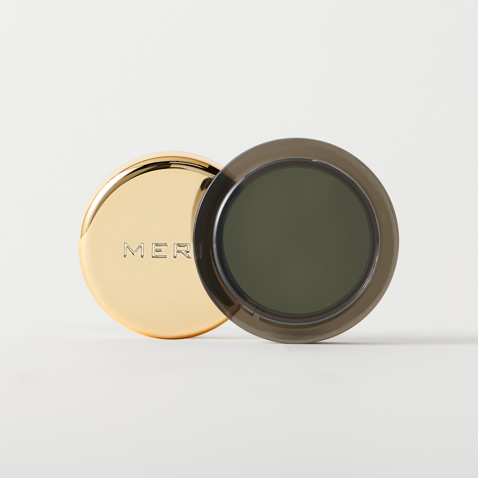 Master || A cream-to-powder eyeshadow by MERIT Beauty in Viper.