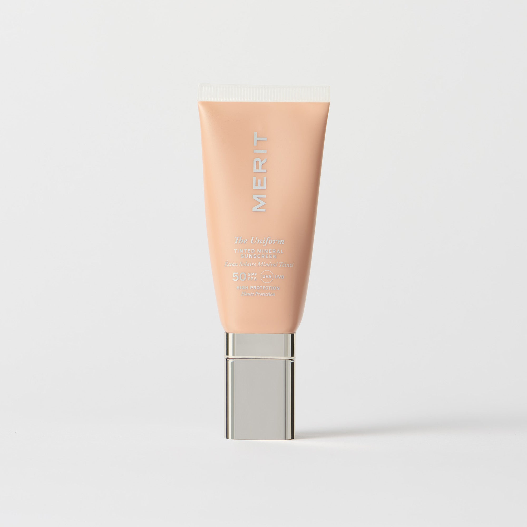 Master || A tube of MERIT brand mineral sunscreen with a sheer tint finish, providing broad spectrum 50 UVA/UVB protection, displayed against a white background.
Shade 26