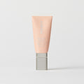 Master || A tube of MERIT brand mineral sunscreen with a sheer tint finish, providing broad spectrum 50 UVA/UVB protection, displayed against a white background. Shade 30