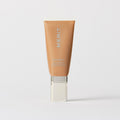 Master || A tube of MERIT brand mineral sunscreen with a sheer tint finish, providing broad spectrum 45 UVA/UVB protection, displayed against a white background. Shade 14
