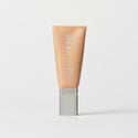 Master || A tube of MERIT brand mineral sunscreen with a sheer tint finish, providing broad spectrum 45 UVA/UVB protection, displayed against a white background. Shade 20