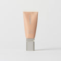 Master || A tube of MERIT brand mineral sunscreen with a sheer tint finish, providing broad spectrum 45 UVA/UVB protection, displayed against a white background.