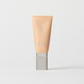 Master || A tube of MERIT brand mineral sunscreen with a sheer tint finish, providing broad spectrum 45 UVA/UVB protection, displayed against a white background. Shade 28