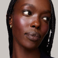 Archival | face::rich | Model is wearing Flush Balm in shade Archival.