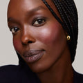 Cheeky | face::rich | Model is wearing Flush Balm in shade Cheeky.