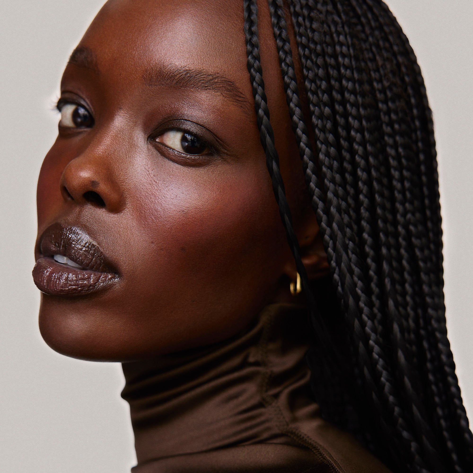 Fox | face::rich | Model is wearing Flush Balm in shade Fox.