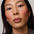 Fox | face::medium | Model is wearing Flush Balm in shade Fox.