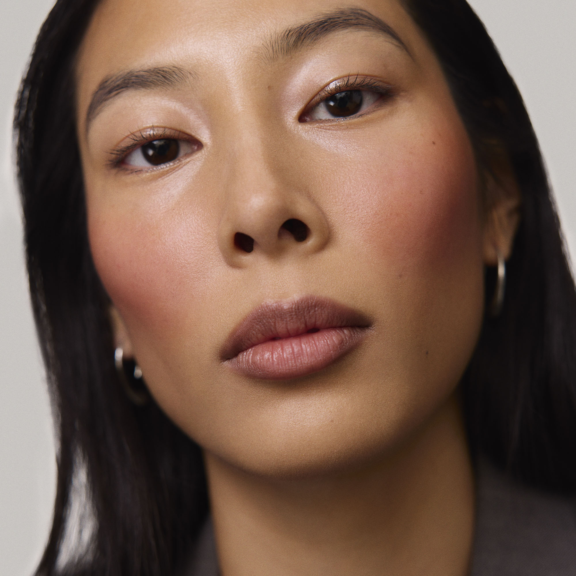 Fox | face::medium | Model is wearing Flush Balm in shade Fox.