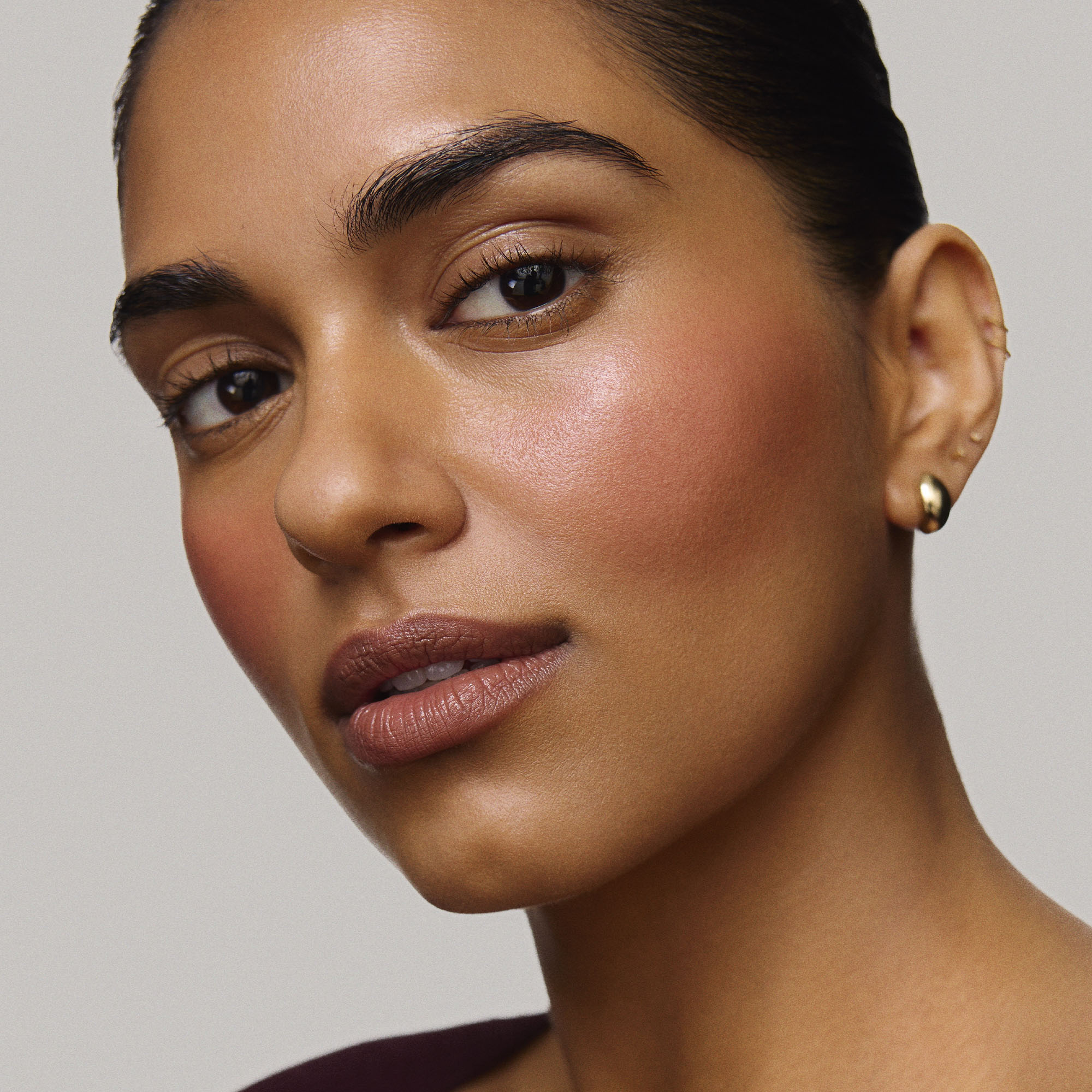 Fox | face::medium | Model is wearing Flush Balm in shade Fox.