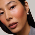 Persimmon | face::medium |  Model is wearing Flush Balm in shade Persimmon.
