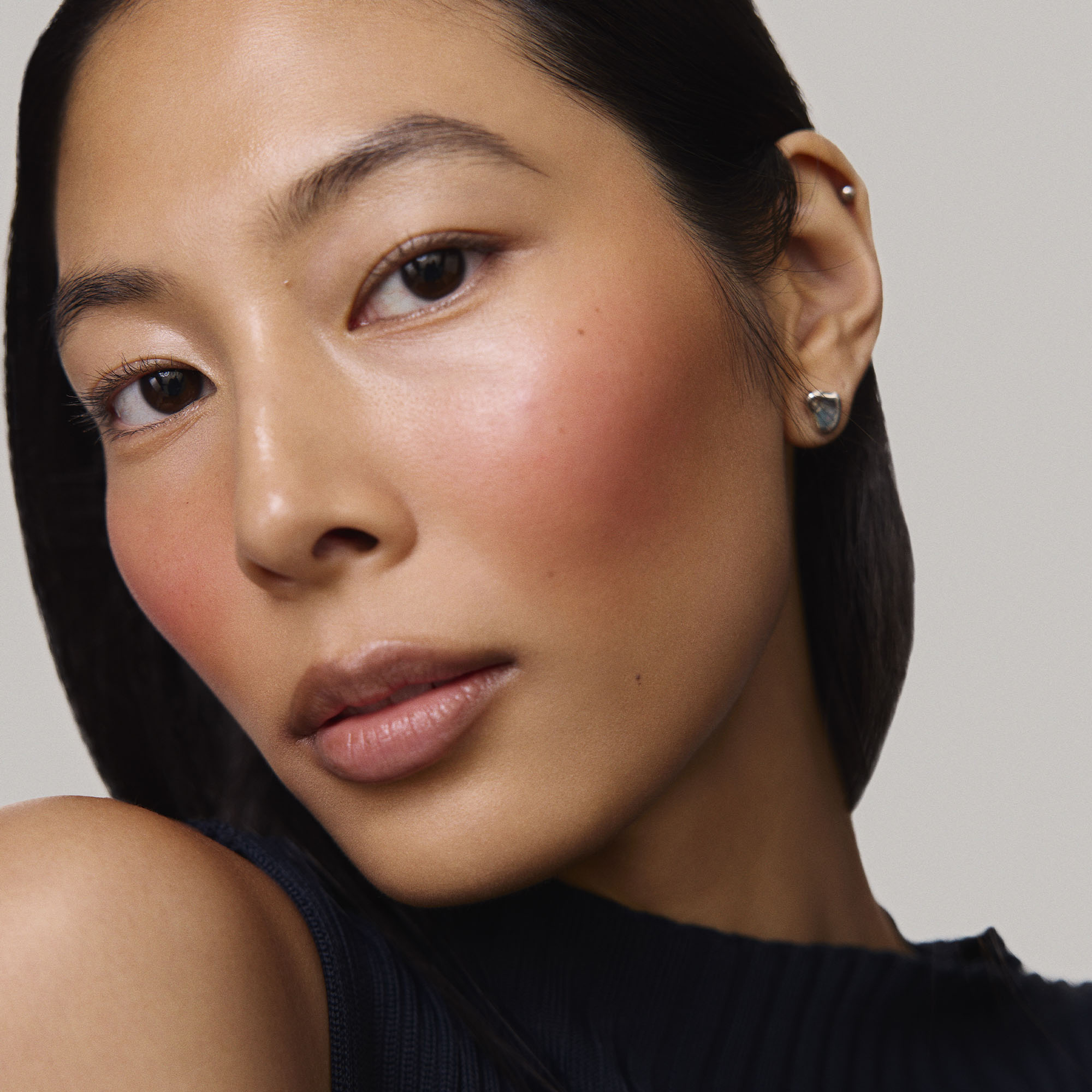 Rouge | face::medium | Model is wearing Flush Balm in shade Rouge.