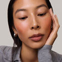 Master || Model is wearing Flush Balm in shade Terracotta.