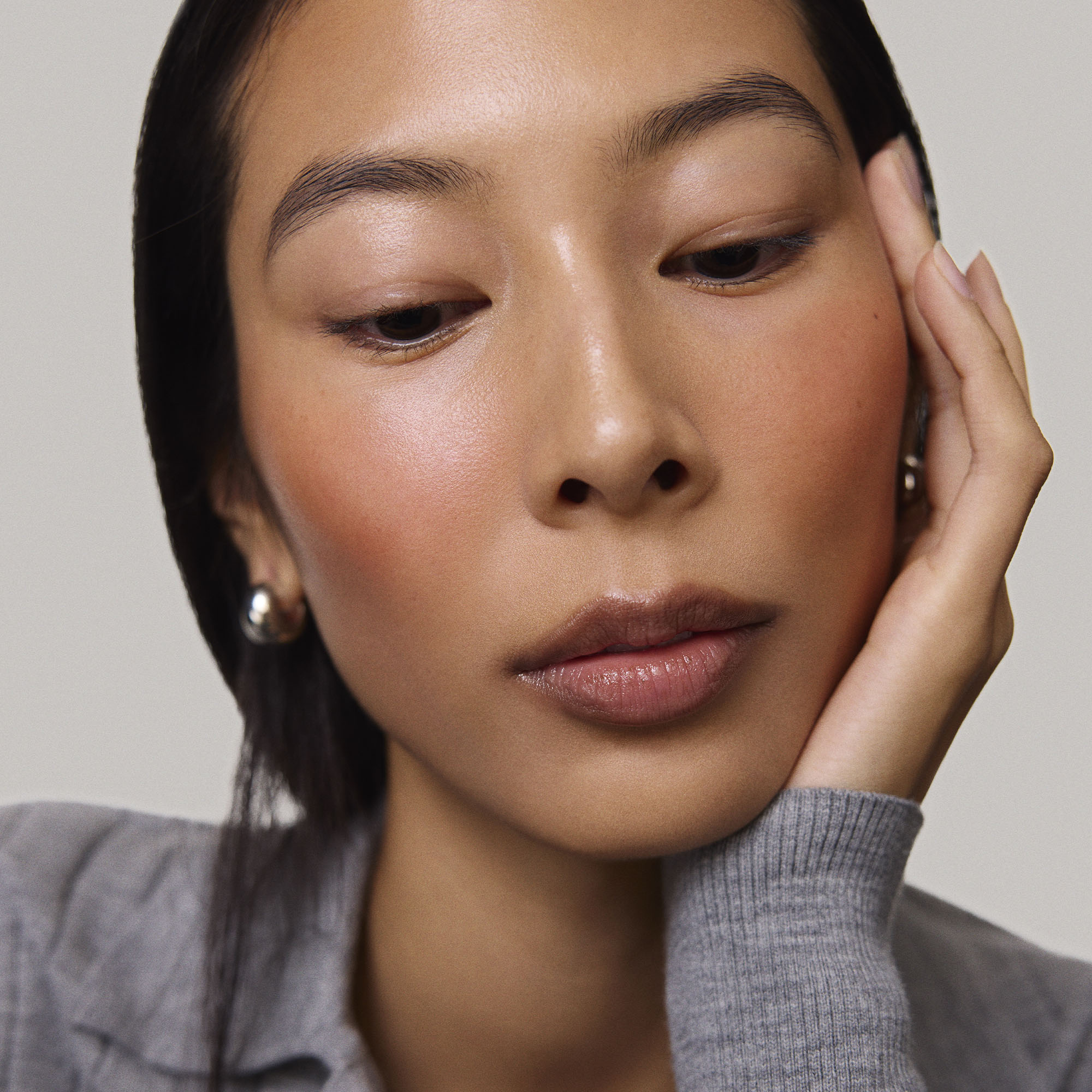 Master || Model is wearing Flush Balm in shade Terracotta.