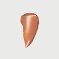 Master || Swatch of flush balm in Terracotta.