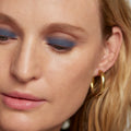Midnight | face::light | Model is wearing Solo Shadow in Shade Midnight.