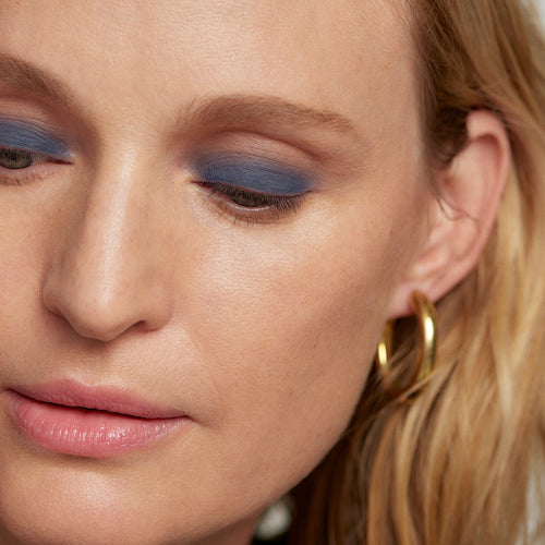 Midnight | face::light | Model is wearing Solo Shadow in Shade Midnight.